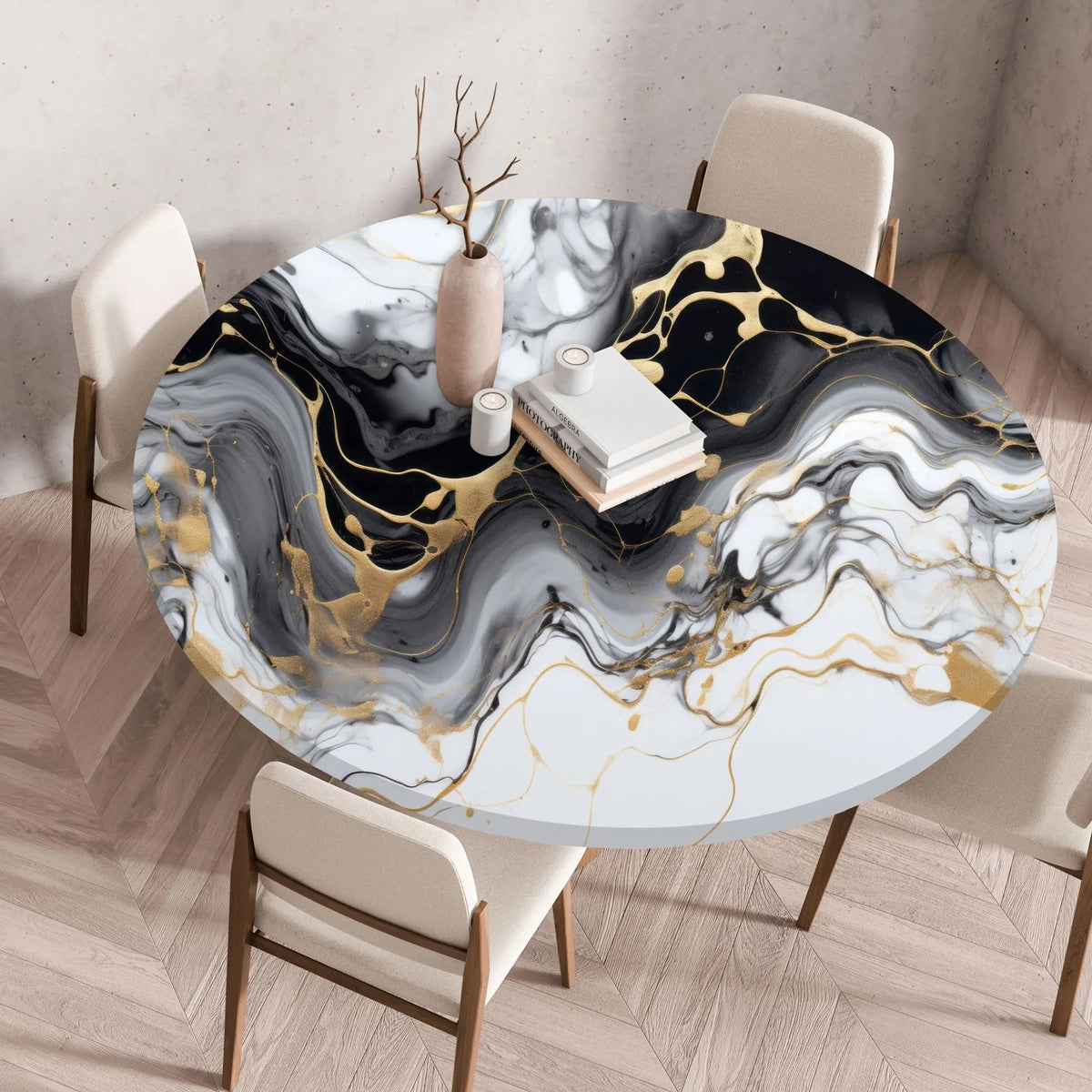 A round table covered with a marble print tablecloth featuring black, white, and gold veining.