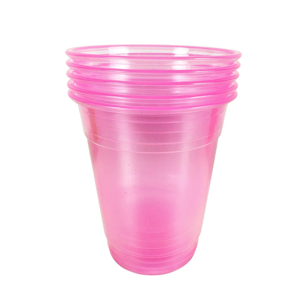 A stack of clear pink plastic party cups with ribbed texture.