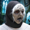 A person wearing a dark hood and white shirt, with a pale, grotesque face mask resembling an alien.