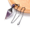 A natural crystal pendulum necklace set featuring a purple amethyst point suspended on a silver chain.