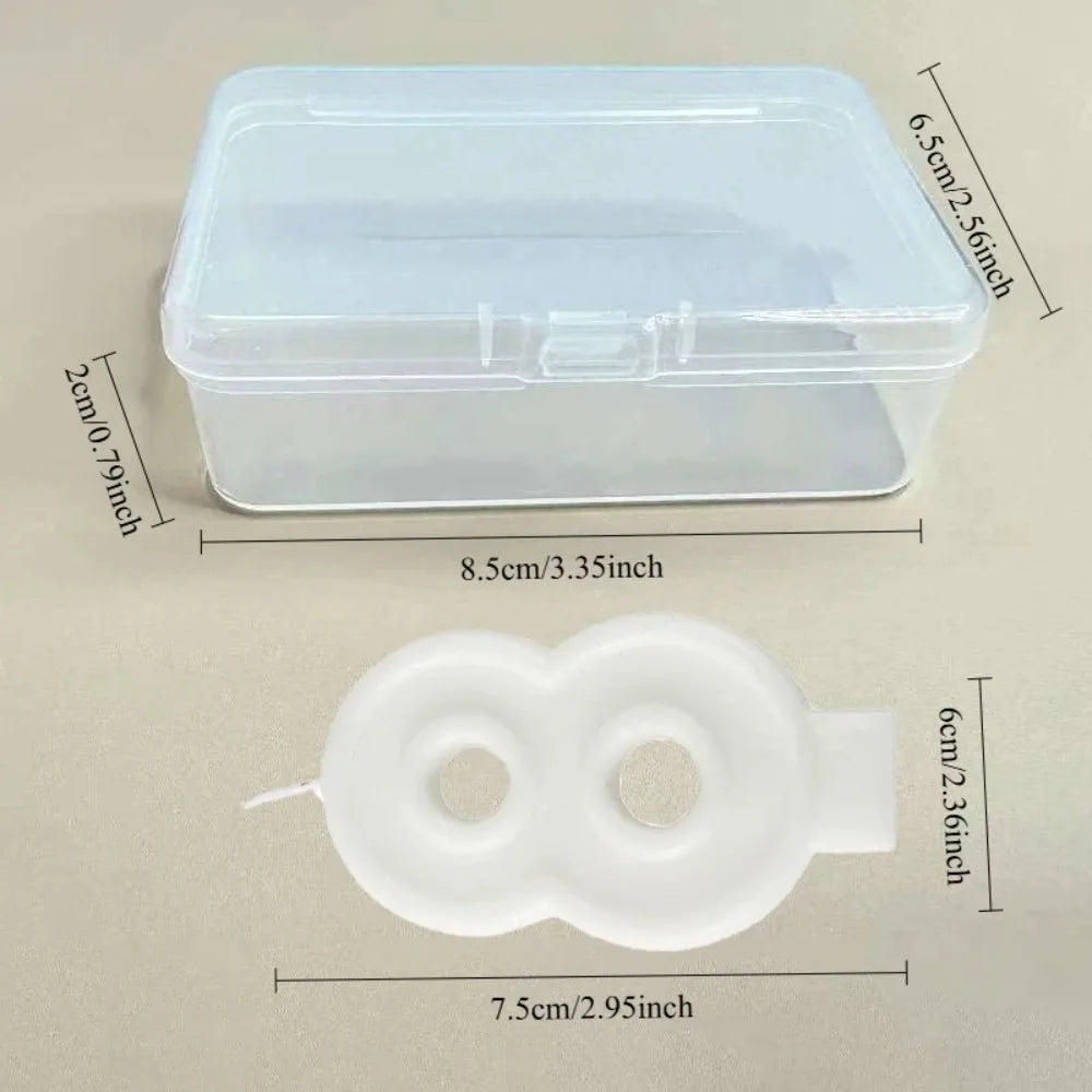 Clear plastic container with a lid and a white silicone mold for making candles