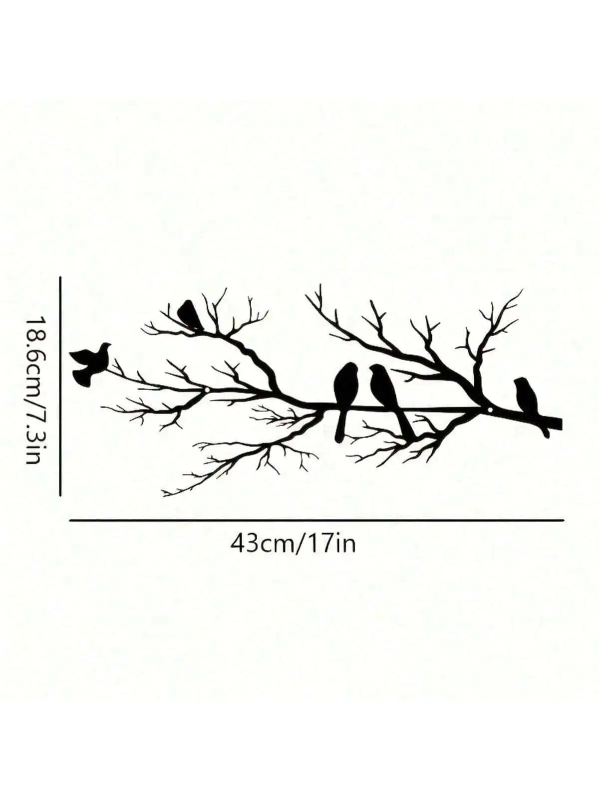 Black silhouette of three birds perched on a bare tree branch, used as wall art.