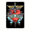 Vintage metal wall art sign featuring a stylized cross with wings and a heart design in red and purple tones.