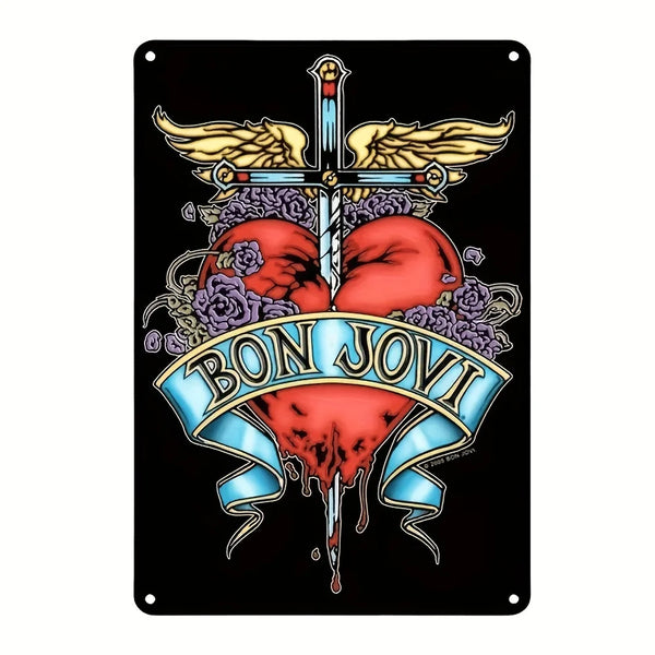 Vintage metal wall art sign featuring a stylized cross with wings and a heart design in red and purple tones.