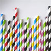 A vertical arrangement of colorful striped and polka dot paper drinking straws in various colors.