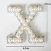 A white alphabet letter X made of pearls and rhinestones, measuring 4.5cm high and 4.3cm wide.