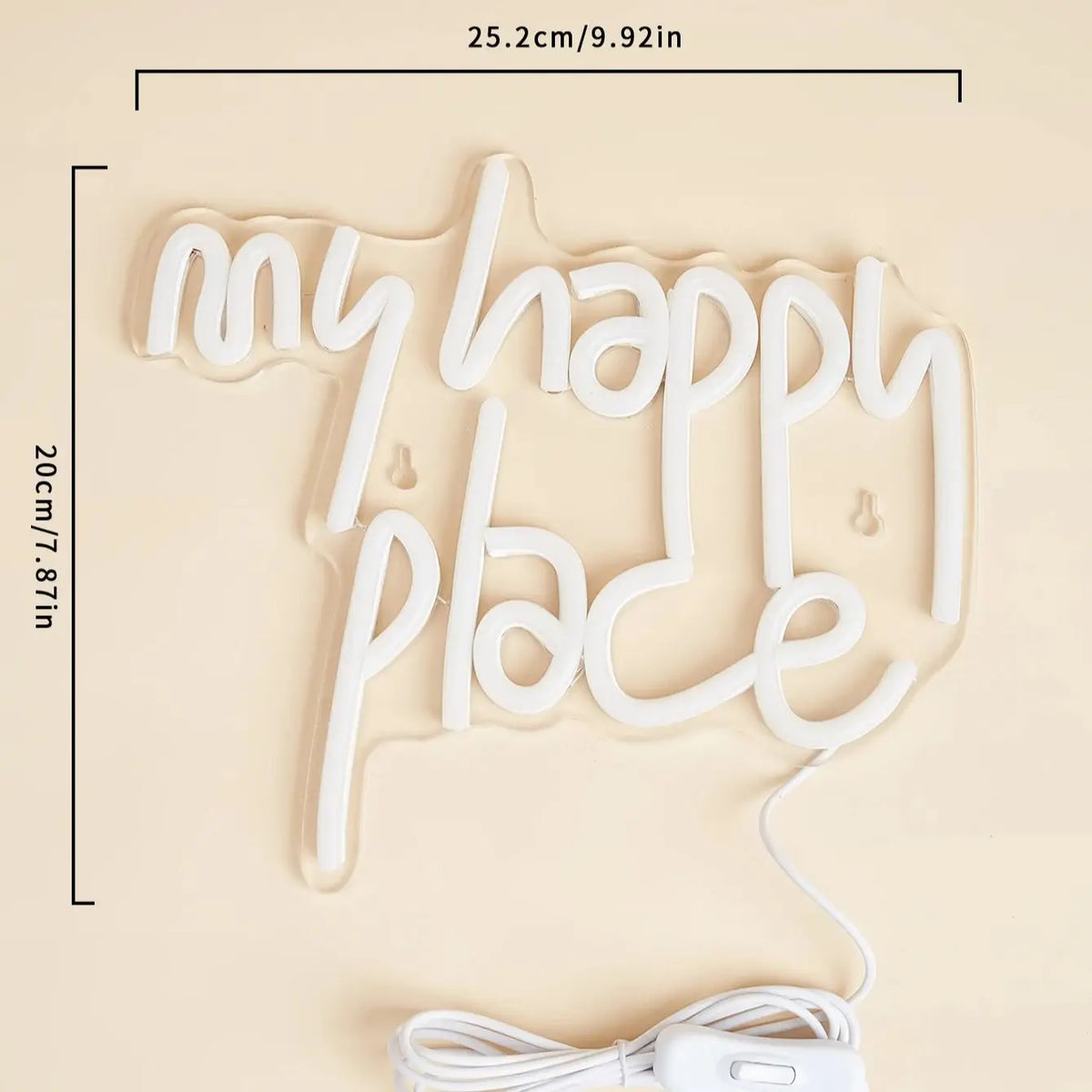 A white LED neon sign shaped like the words My Happy Place displayed on a light beige background.