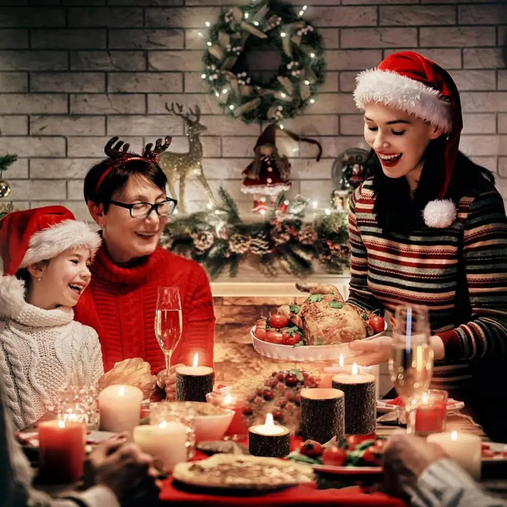 A woman and a child smiling in a festive setting surrounded by rustic wooden stump candle holders.