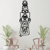 Black metal silhouette wall art featuring a minimalist cat and woman design on a white wall.