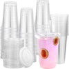 A stack of clear disposable plastic cups with flat lids and a glass containing pink beverage and fruit slices.