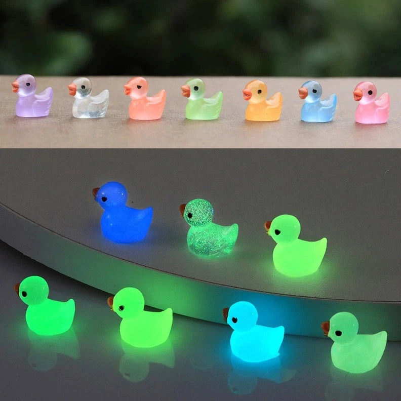 A set of colorful resin mini mushroom figurines displayed on a dark surface.