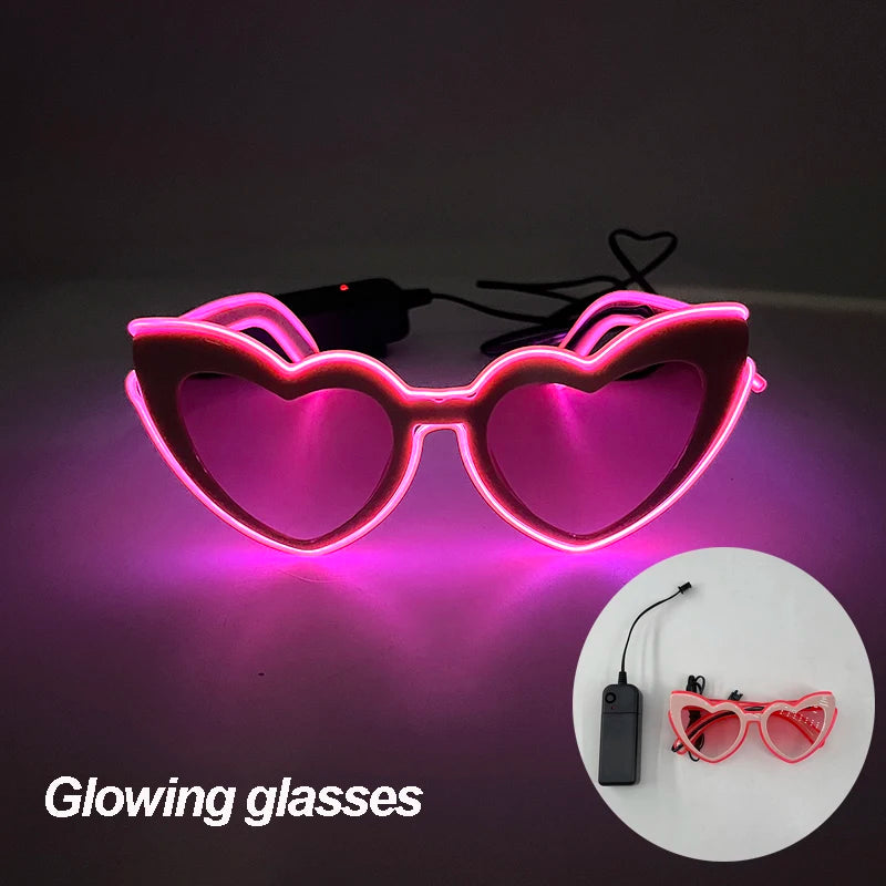 Pair of glowing pink heart-shaped sunglasses with a black cord.
