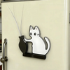A silver magnetic acrylic cat whiskered decor mounted on a light-colored door.
