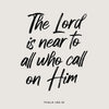 Black script text on a light gray background featuring the Bible verse Psalm 145:18