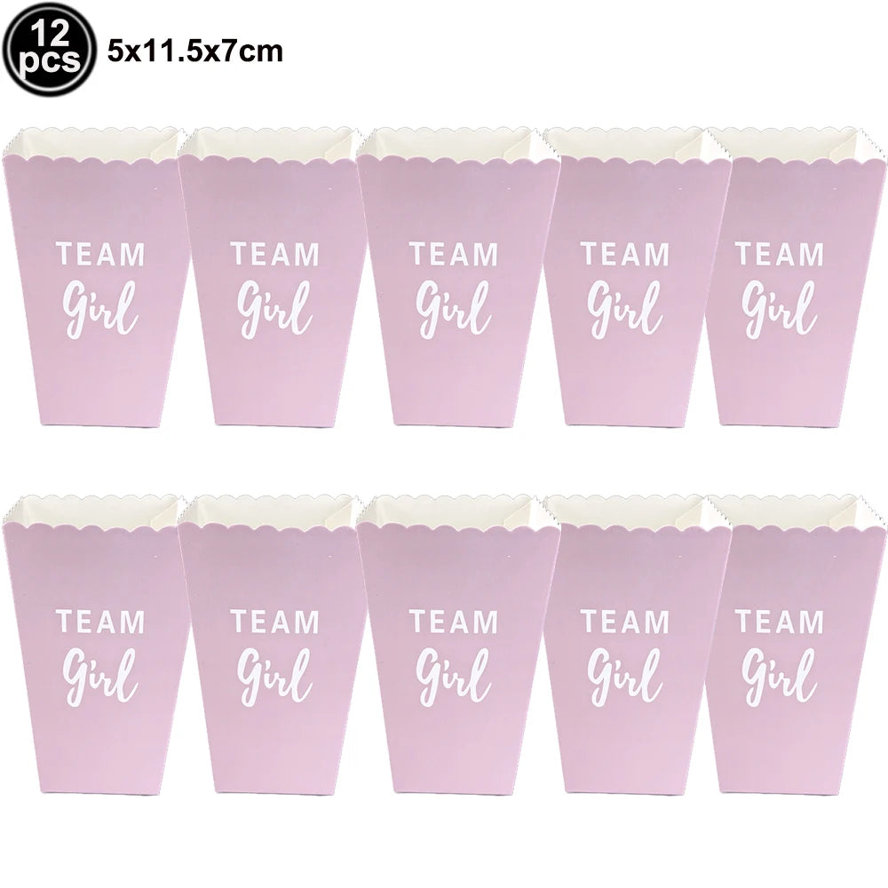 Twelve pink foil baby bottle balloons with the text Team Girl for baby shower decor