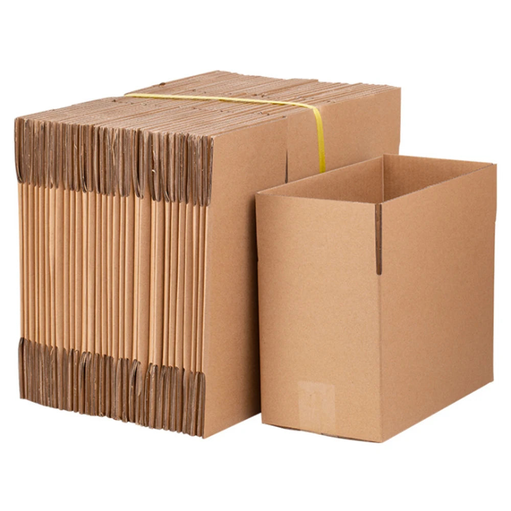 A stack of brown corrugated cardboard boxes tied with yellow string.
