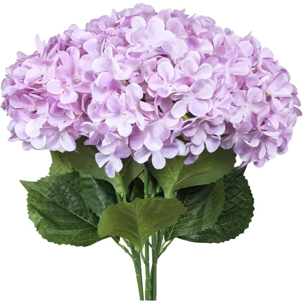 A bouquet of artificial lilac purple hydrangea silk flowers with green leaves.