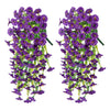 Two bunches of artificial purple morning glory flowers hanging vertically