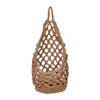 A handcrafted boho macrame hanging storage basket made of natural beige fiber.