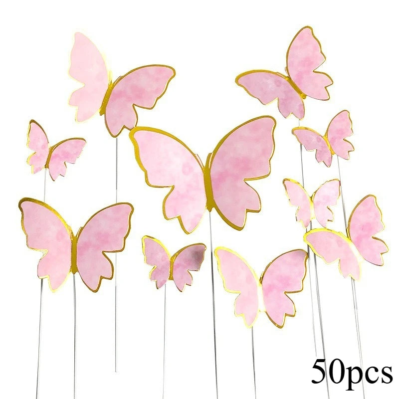 A collection of 50 paper butterfly cake toppers in shades of pink and gold.