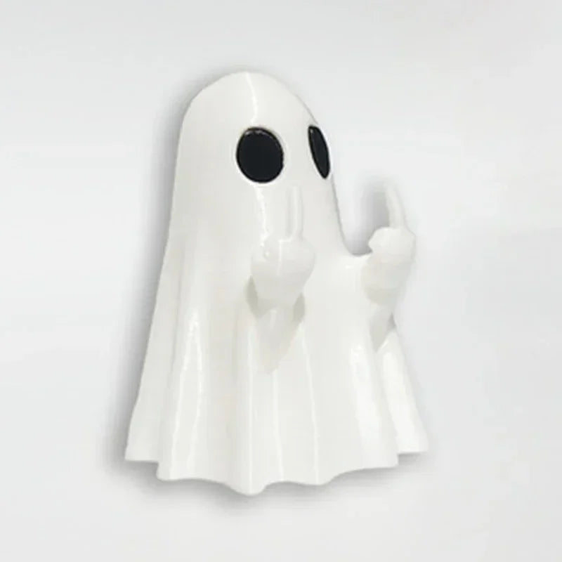 A white glow-in-the-dark ghost figurine with a playful pose.