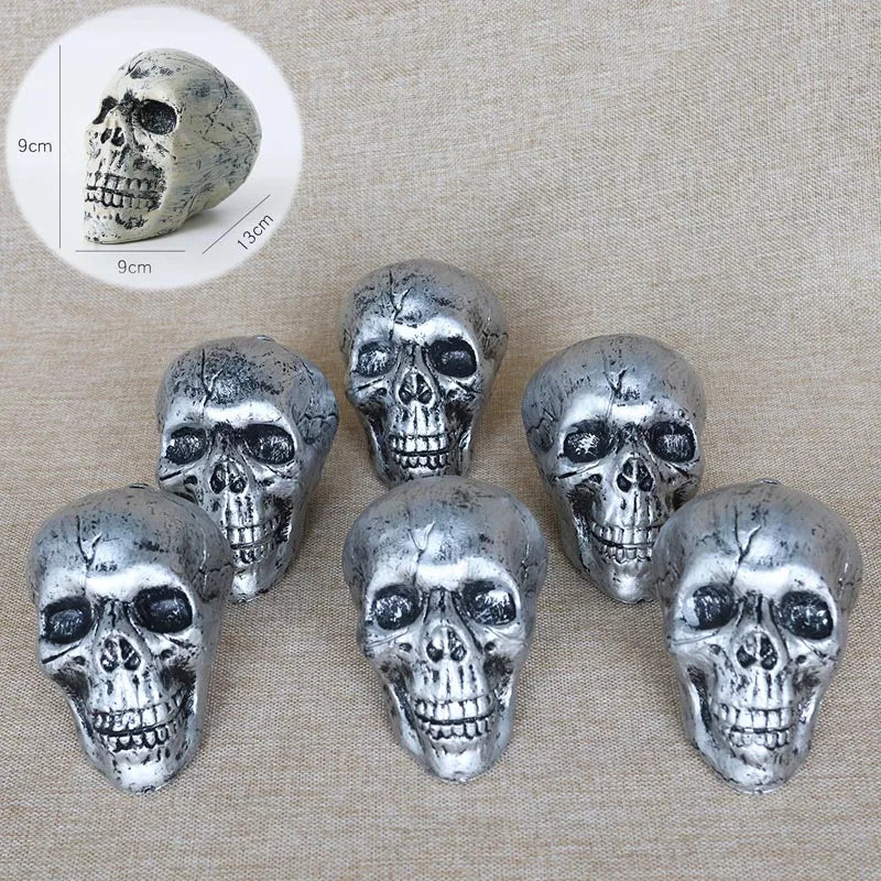 A set of realistic silver skeleton arm stakes for Halloween lawn decor, shown with a scale reference.