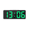 A black LED digital alarm clock displaying the time 13:06 with bright green numerals.