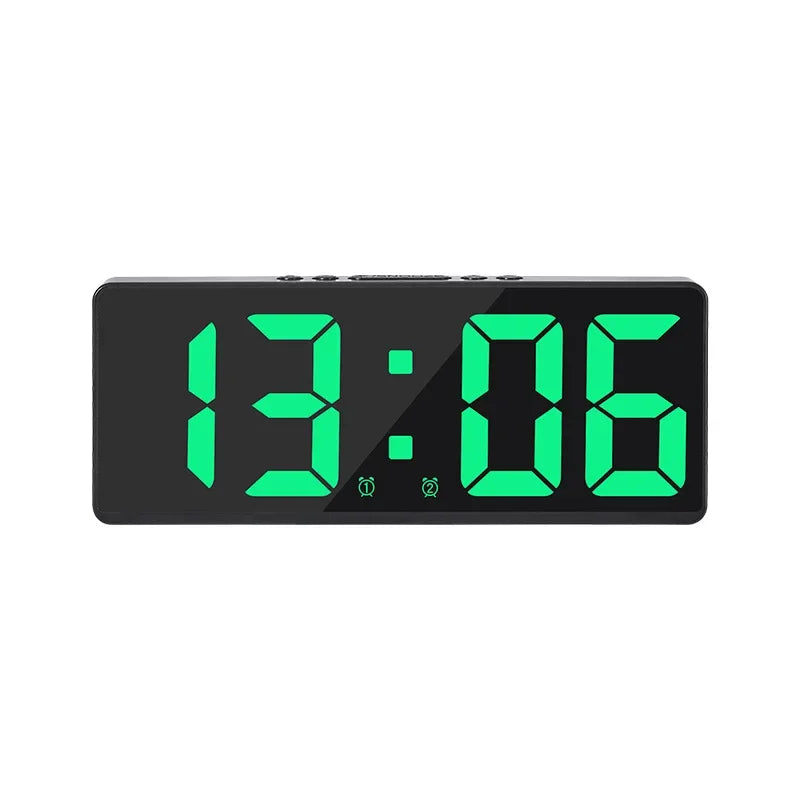 A black LED digital alarm clock displaying the time 13:06 with bright green numerals.