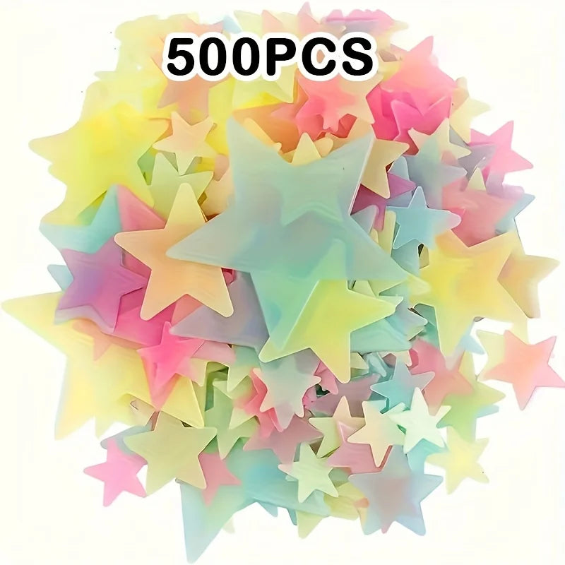 A pile of 500 glow in the dark star wall decals in various pastel colors.