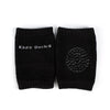A pair of black knitted socks with the text Kids Socks on the cuff.