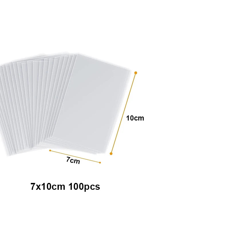 A stack of 100 clear cellophane treat bags with wire ties, showing a 7cm by 10cm size.