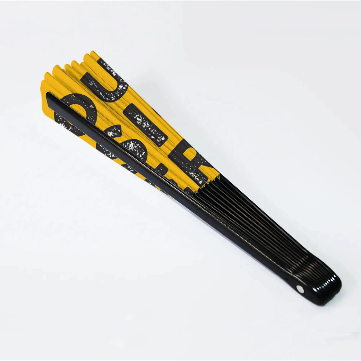 A yellow and black folding hand fan with a black handle and decorative text.