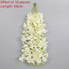 A long, cascading garland of white artificial flowers with ten pieces, measuring 60cm in length.