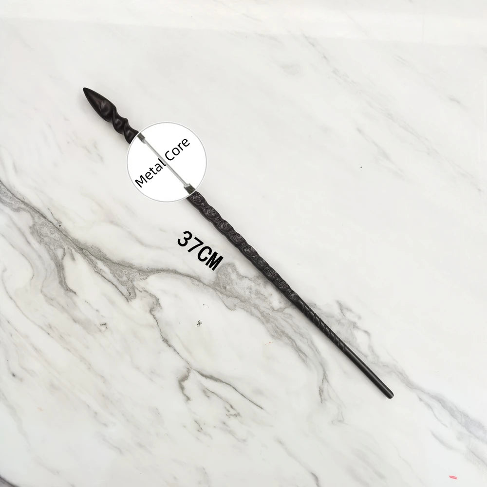 A black metal magic wand replica with a distinct pointed shape is displayed on a white marble surface.