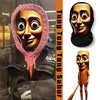 A close-up of a 3D printed novelty face mask featuring a wooden-toned character with large eyes and a pink hood.