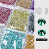 A collection of round flatback resin rhinestones in various colors including gold, green, silver, and purple, shown with size