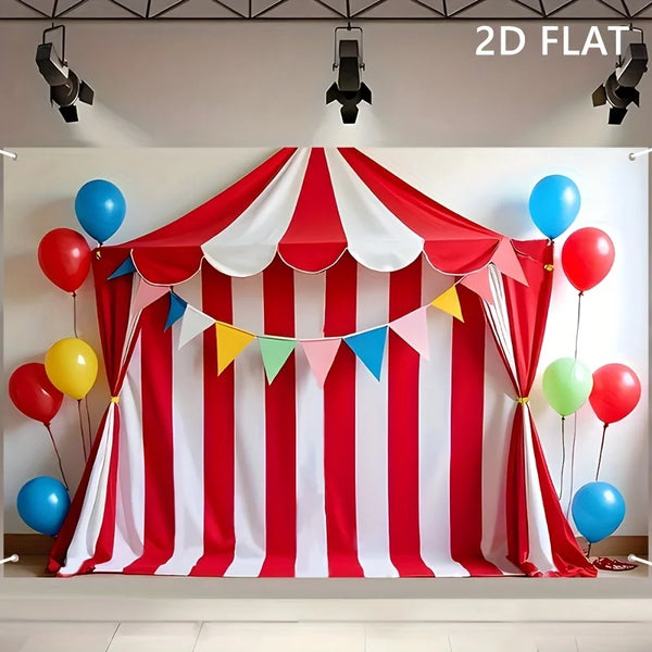 A red and white striped circus party backdrop banner with draped fabric and colorful pennants.