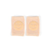 A pair of light pink knitted knee pads with yellow smiling faces for crawling infants.