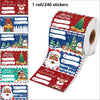 A roll of Christmas gift tag stickers featuring various holiday designs like Santa, reindeer, and festive scenes.