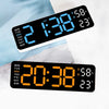 A digital wall clock displaying the time 2:38, temperature 58 degrees, and humidity percentage on a white surface.