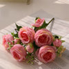 A bouquet of pink silk peony roses for weddings and home decor.
