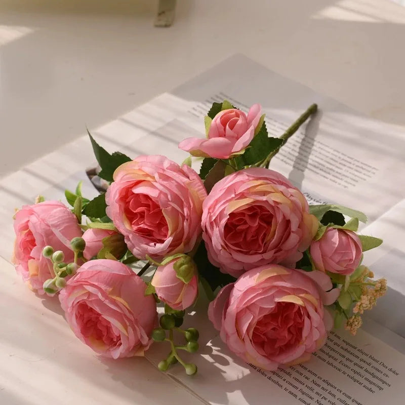 A bouquet of pink silk peony roses for weddings and home decor.