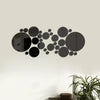 A black circular mirror wall decal design featuring various sized circles arranged in a scattered pattern.