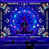 A dark blue tapestry featuring a silhouette of a meditating figure centered within a glowing lotus design.