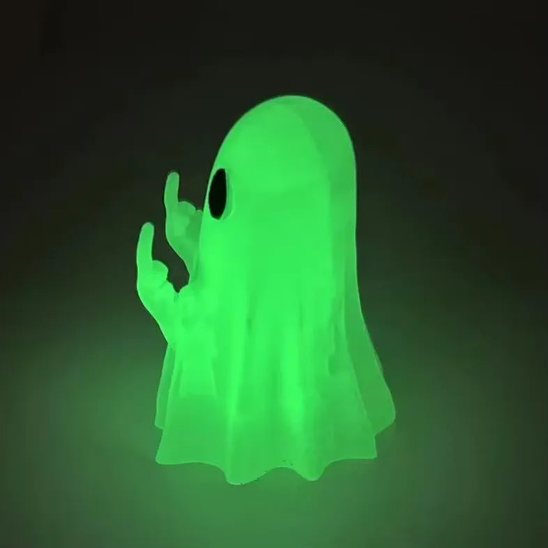 A glowing neon green ghost figurine with a playful pose against a dark background.
