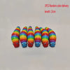 A row of colorful, elongated fidget slug toys in various shades of orange, green, and blue.