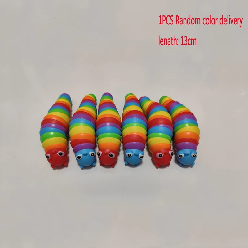 A row of colorful, elongated fidget slug toys in various shades of orange, green, and blue.