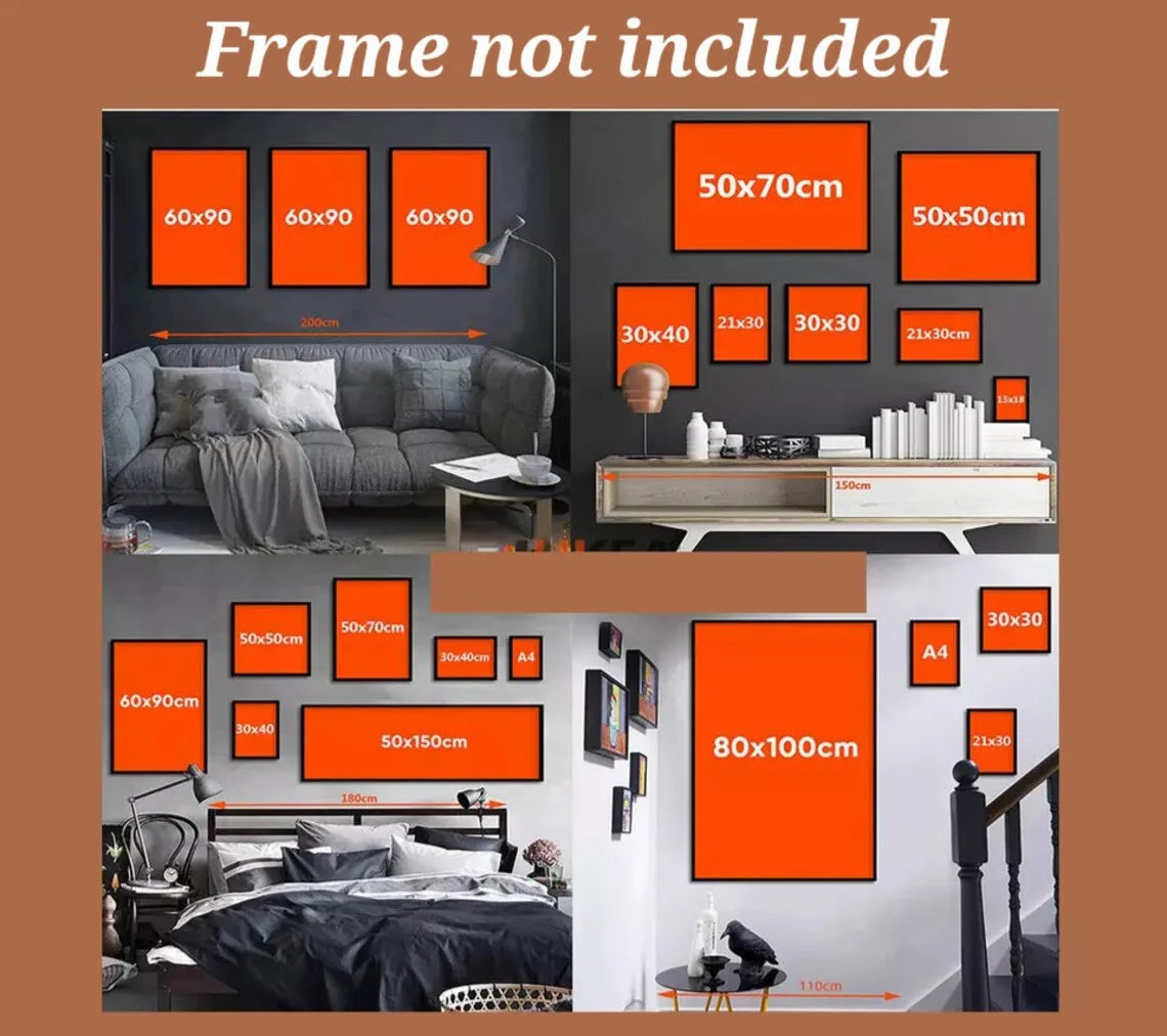 A display of various sized orange framed art pieces on a dark wall and a bed with bedding.
