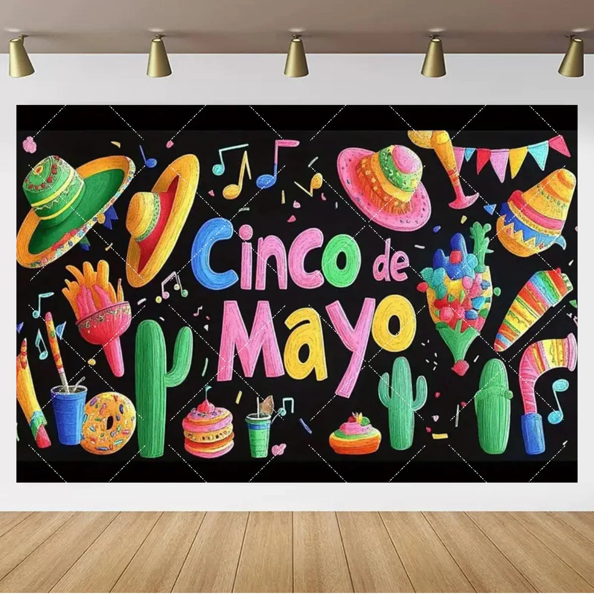 A black chalkboard decorated with colorful lettering and illustrations celebrating Cinco de Mayo featuring cacti and festive 