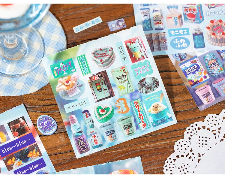 A sheet of retro cartoon PET die cut stickers for scrapbooking and journaling is displayed on a wooden surface.